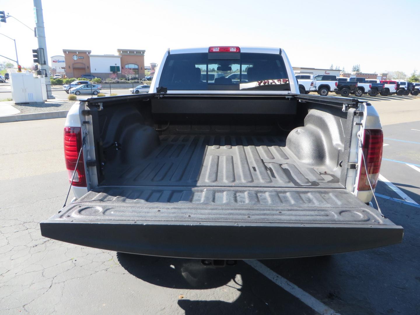 2016 SILVER /BLACK RAM 2500 Laramie Crew Cab SWB 4WD (3C6UR5FL3GG) with an 6.7L L6 OHV 24V TURBO DIESEL engine, 6A transmission, located at 2630 Grass Valley Highway, Auburn, CA, 95603, (530) 508-5100, 38.937893, -121.095482 - Leveled Ram sitting on Fuel Offroad wheels, Falken Wildpeak AT tires, Amp Power steps, Rolling Bed cover, Color matched fender flares, and window tint. - Photo#12